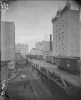 Black and white photograph of riverfront flour mills before the 1878 explosion.