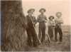 Black and white photograph of Father Anatole Oster (left) with farmers in Clontarf Township, c.1885.