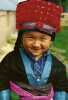 Color image of a Hmong American boy in traditional clothing. Photographed by Vue Xiong, c.1992.