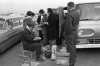 Black and white photograph of Tailgaters, Metropolitan Stadium, Bloomington, Minnesota. Photographer: Gillis, Minneapolis Star Tribune, 1964.