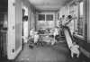 Black and white photograph of children playing at the Neighborhood House, c.1925.