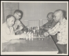 Golden Agers playing chess at Hallie Q. Brown House
