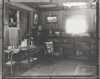 Black and white photograph of the living room of the Keck family home, ca. 1912.