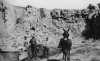 Black and white photograph of workers and a mule at a quarry in what now is Blue Mounds State Park, ca. 1880s.