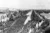 Black and white photograph of U.S. Soldiers of the Thirty-fourth Division marching through Tunis, 1943.