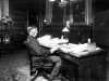 Governor John Lind seated in his office in the State Capitol