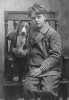 Black and white photograph of Charles Lindbergh with his dog "Dingo," c.1912. 