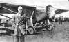 Black and white photograph of Charles Augustus Lindbergh with the "Spirit of St. Louis," c.1927.