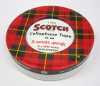 photograph of a red plaid scotch tape container