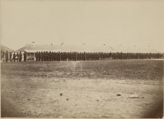 Second Minnesota Volunteer Infantry standing in front of the Long Barracks