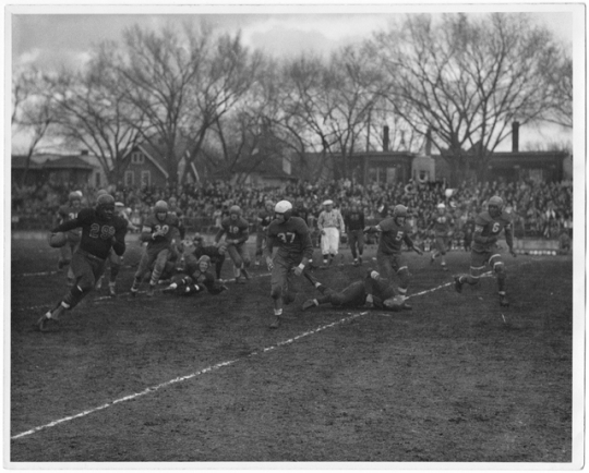 Black and white photograph of a football game at Phyllis Wheatley House, 1940.