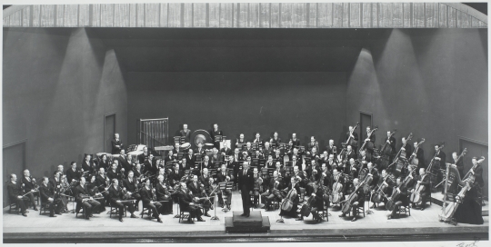 Dimitri Mitroupoulos on the conductor's podium with the Minneapolis Symphony Orchestra