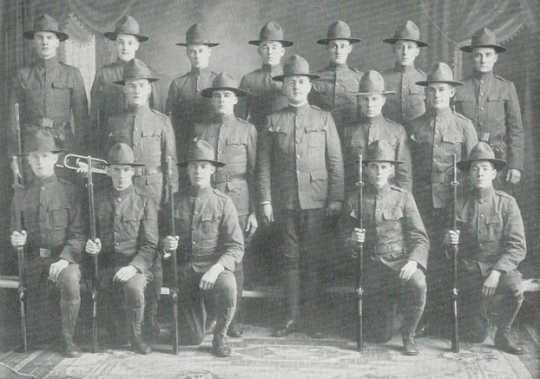 Black and white photograph of corporals in military drill squad, 1918. 