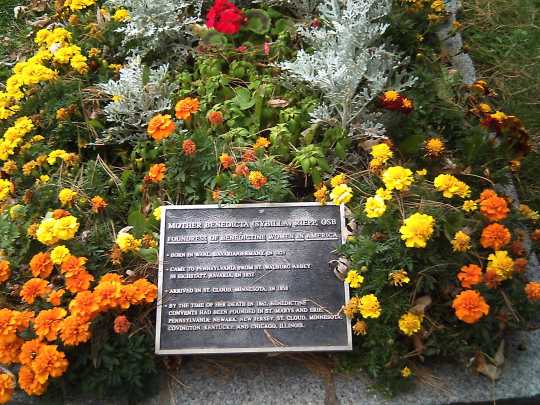 Color image of the identification plaque at the burial site of Mother Benedicta Riepp in the cemetery at Saint Benedict’s Monastery, St. Joseph, 2015.