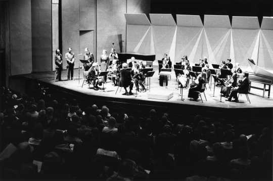 Black and white photograph of the Mayor of Saint Paul, Lawrence Cohen, wishing the SPCO bon voyage on their tour of Eastern Europe, 1975.