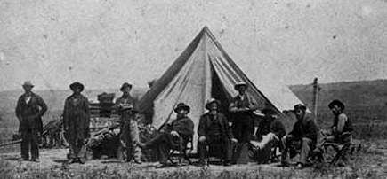 Black and white photograph of the headquarters of Brackett's Battalion near Sioux City, Iowa, 1865.