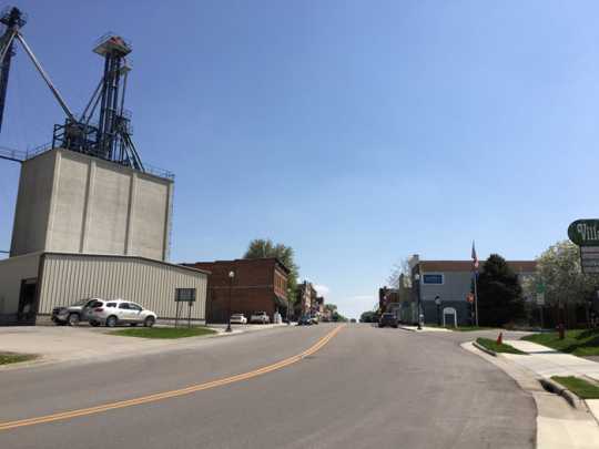 Photograph of tntrance to Harmony’s Main Street, grain elevator