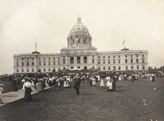 Black and white photograph of the Minnesota Capitol before the installation of the Quadriga, possibly during the dedication ceremony, 1905.