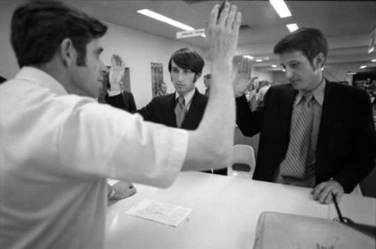 Black and white photograph of Jack Baker and James Michael McConnell applying for a marriage license in Minneapolis, 1970.