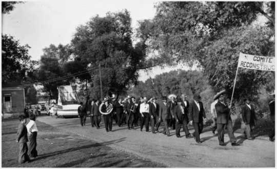 Black and white photograph of a Cinco de Mayo parade, West side, 1938.