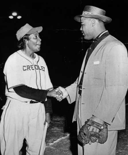 Black and white photograph of Toni Stone meeting her idol, boxer Joe Louis, c.1949.