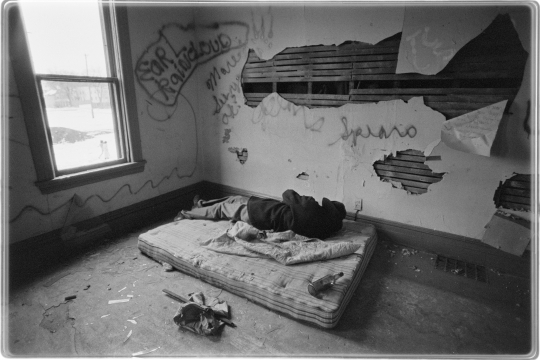 Person without housing sleeping in an abandoned building