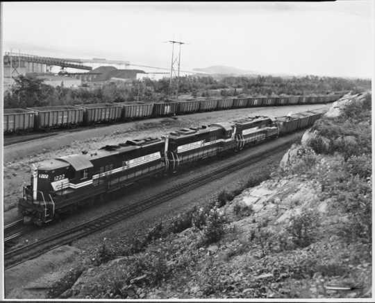 First Train of Taconite to Silver Bay, Minnesota, 1955. The first train of taconite from Reserve Mining Company’s Peter Mitchell Pit was shipped to the concentration facilities in Silver Bay in 1955.