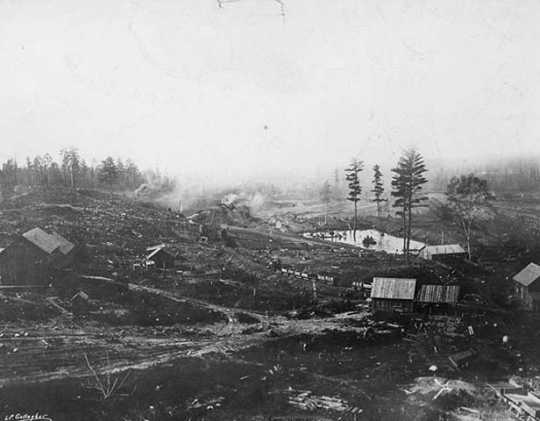 Black and white photograph of the first mine on the Mesabi Range, near Mountain Iron, ca. 1892. Photographed by Louis Perry Gallagher.