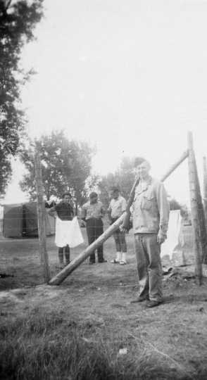 Black and white photograph of Harvey Fleshner guarding German prisoners of war in Moorhead, ca. 1943–1945.