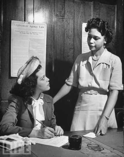 Hilda Sims, Minneapolis actress-singer, at the desk of Governor C