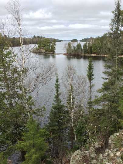 Color image of a rocky hillside and Lake Vermilion. Photograph by Minnesota Department of Natural Resources Staff, May 22, 2014.