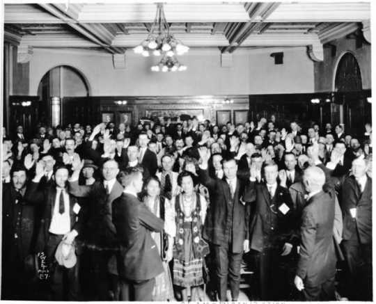 Immigrants taking oath of citizenship