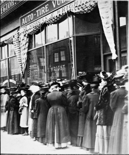 Women waiting in line to vote in an election (probably for a school board) in a downtown Minneapolis precinct c.1908.