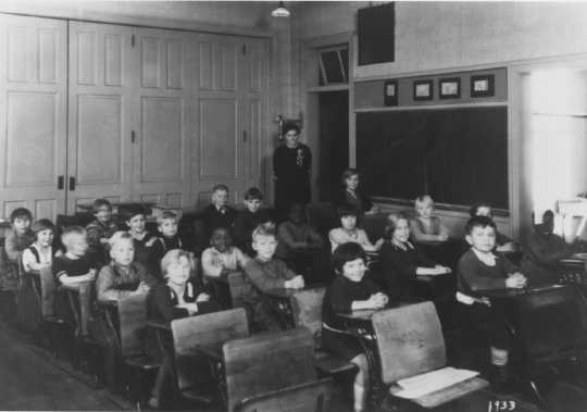 Photograph of John, Daniel, and Jessie Lyght in school