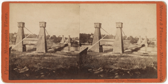 Black and white photograph of the Hennepin Avenue Bridge looking toward Nicollet Island, c.1865.