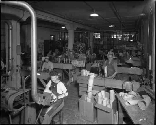 Black and white photograph of the making artificial limbs at Minneapolis Artificial Limb Company, Minneapolis, 1945.