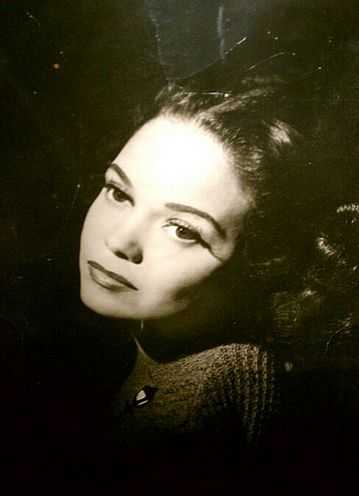 Hilda Sims, Minneapolis actress-singer, at the desk of Governor C