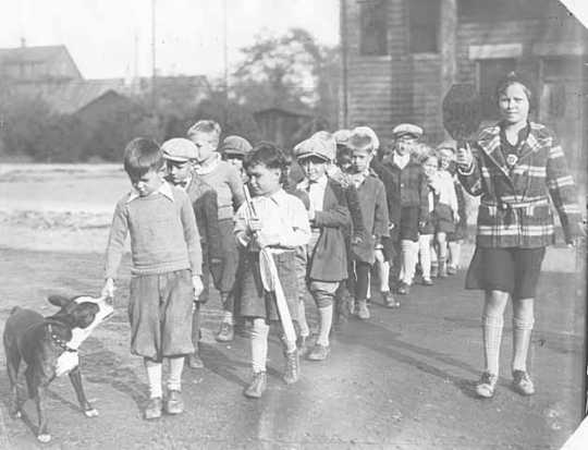 Group of children being escorted by School Police.