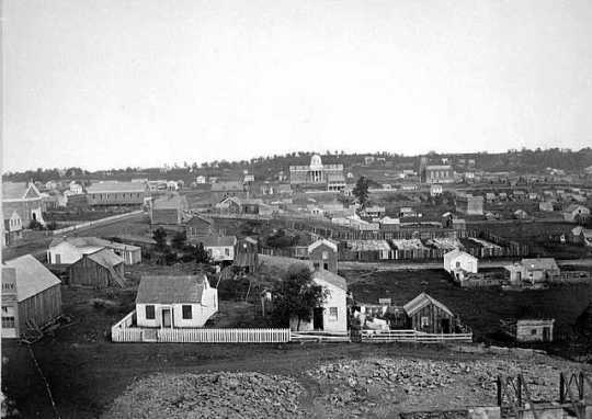 Black and white photograph of a view of St. Paul including the Capitol building, 1857.