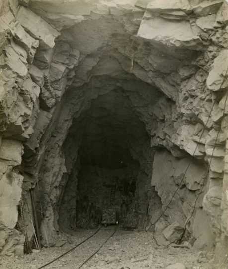 Black and white photograph of the tunnel entrance, Duluth, Winnipeg & Pacific Railway tunnel at Short Line Park, Duluth, Minnesota, 1911.